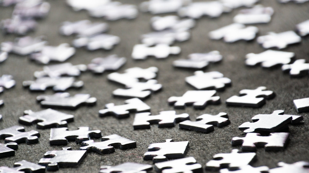 a close up of a bunch of puzzle pieces
