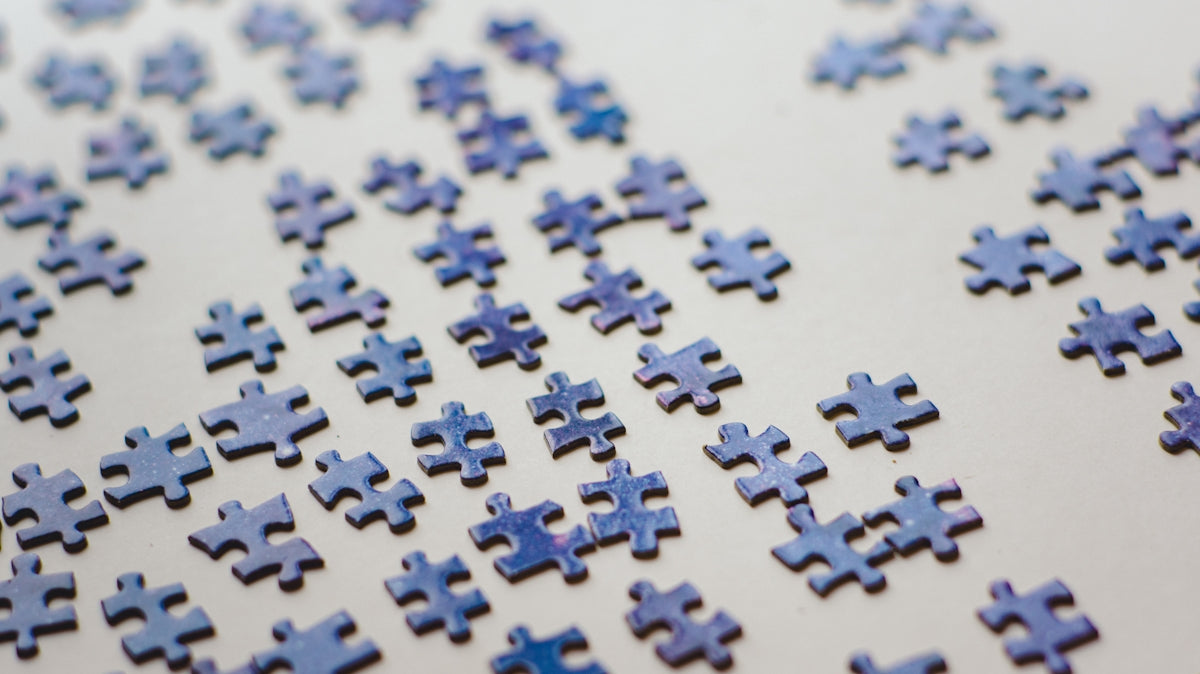 a close up of a blue puzzle piece