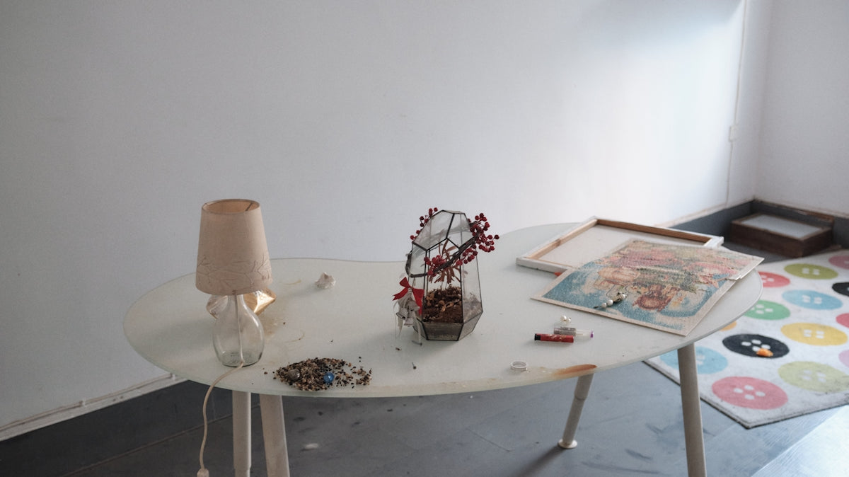 a table with a vase of flowers on it