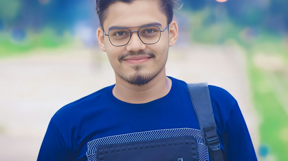 a man wearing a smart t - shirt and carrying a backpack