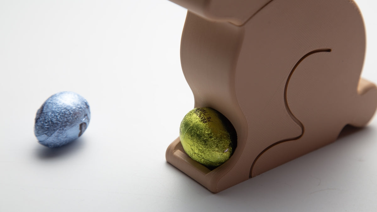 A wooden bunny hides an egg.