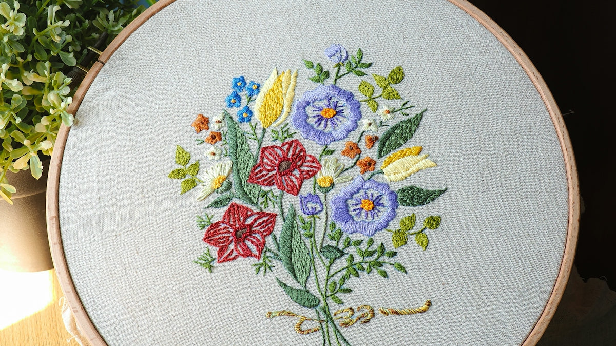 Embroidery hoop with a floral bouquet design.