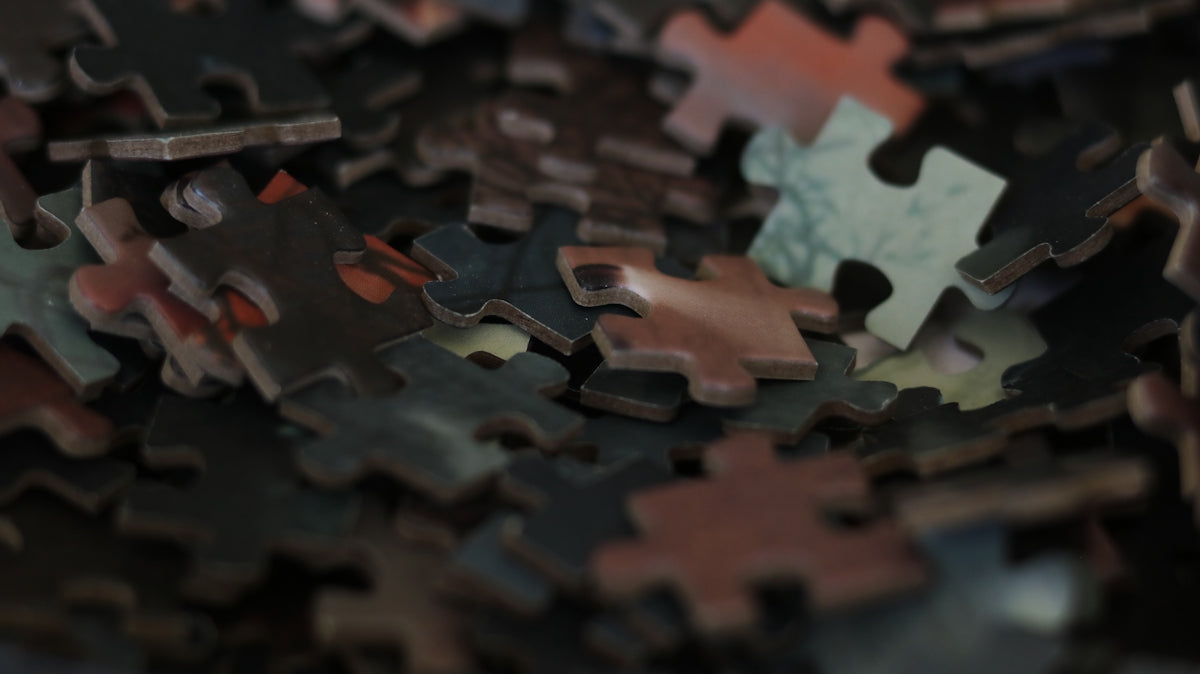 A pile of scattered puzzle pieces