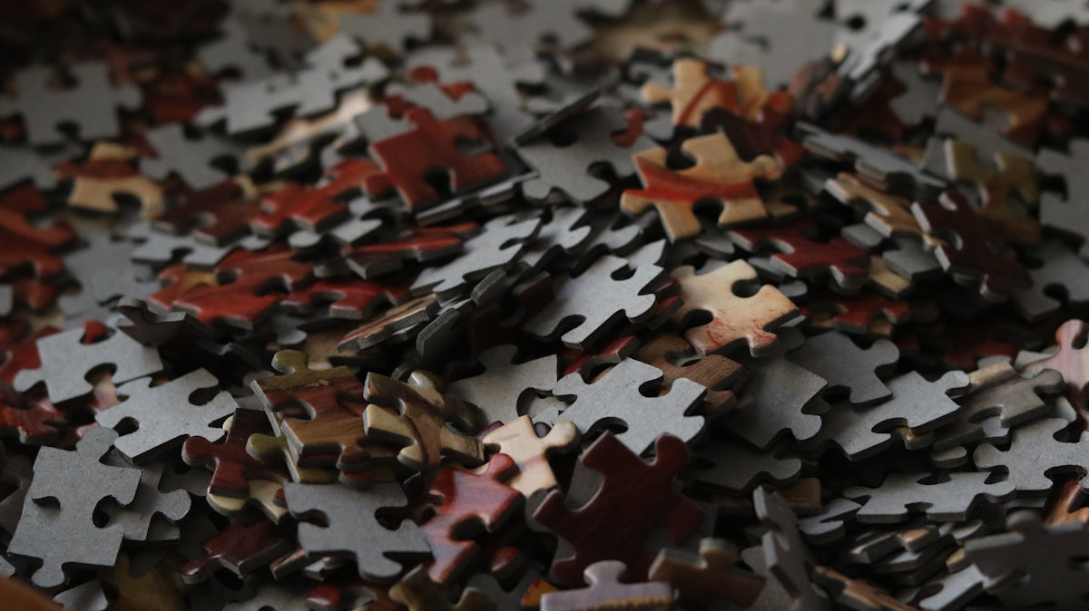 A pile of scattered puzzle pieces
