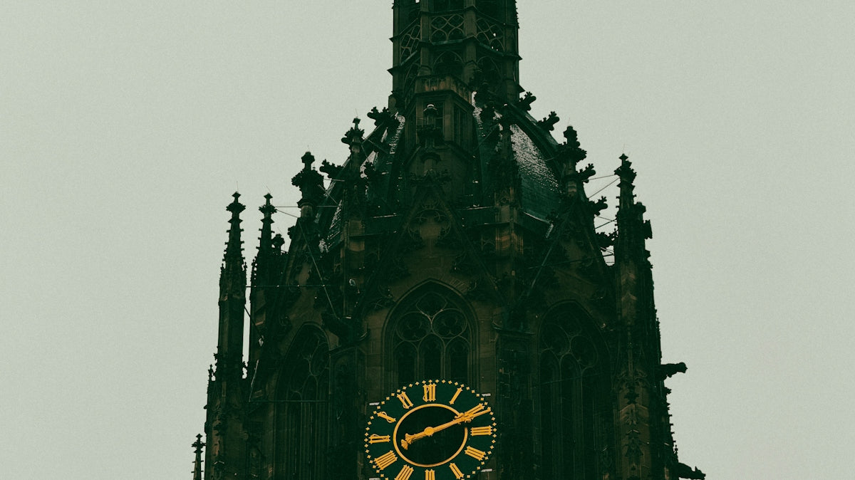 Gothic cathedral tower with a large clock