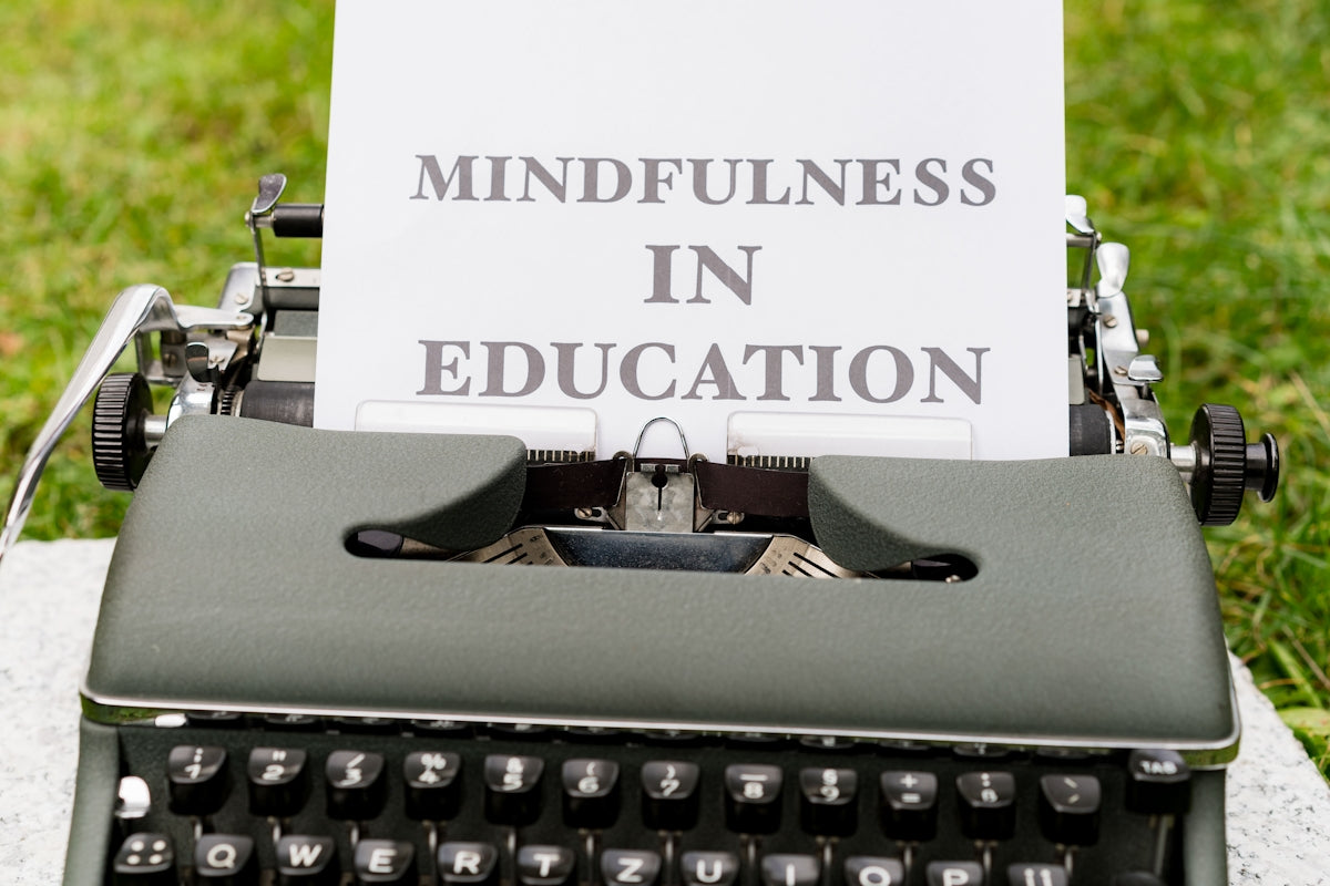an old typewriter with a sign that says mindfulness in education
