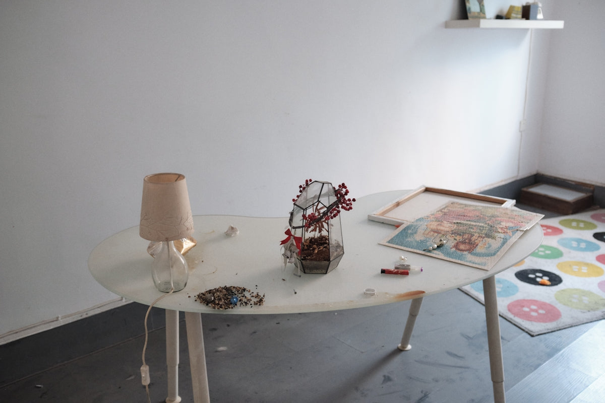 a table with a vase of flowers on it