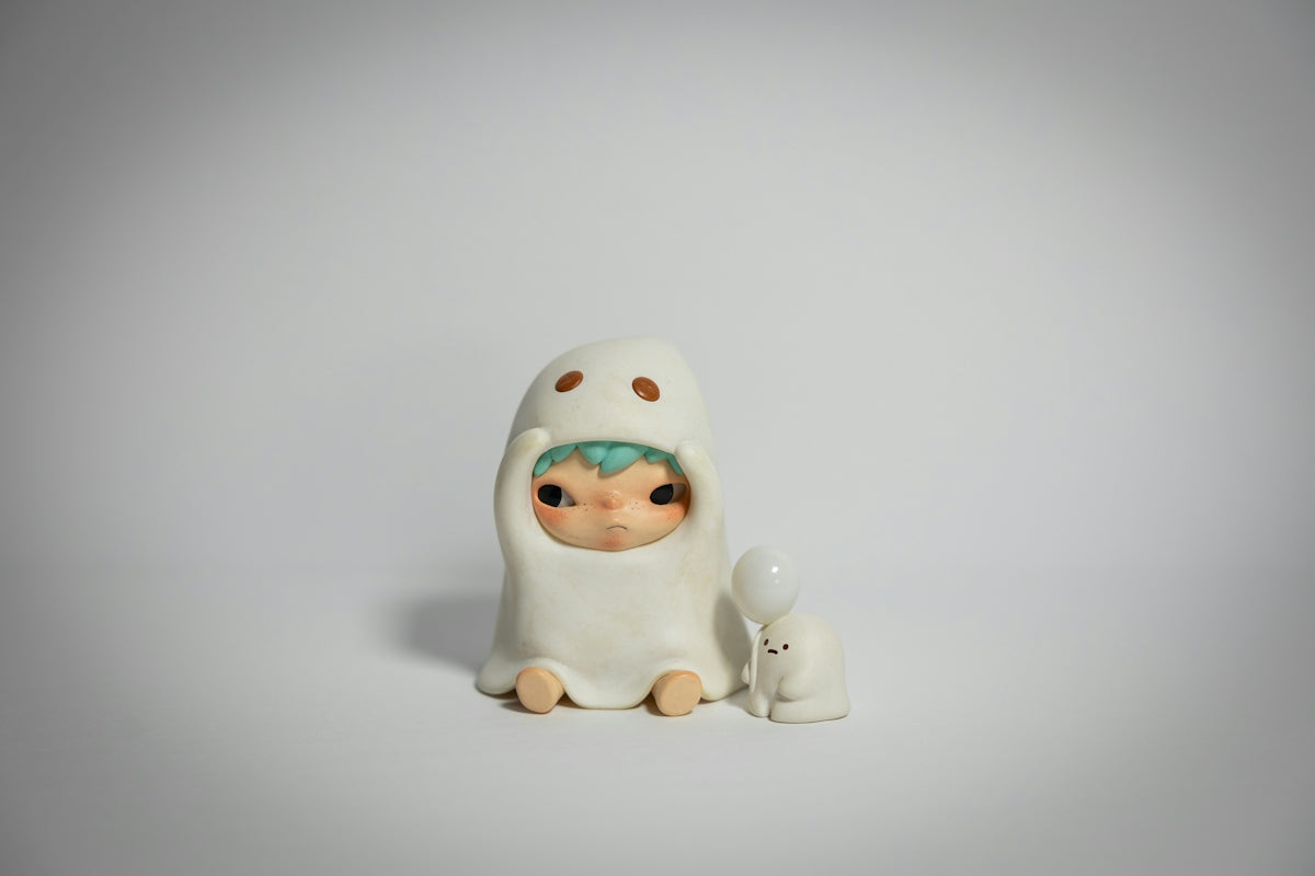 A cute ghost figure with a small bunny