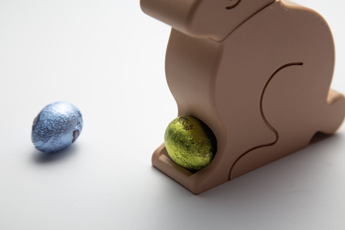 A wooden bunny hides an egg.