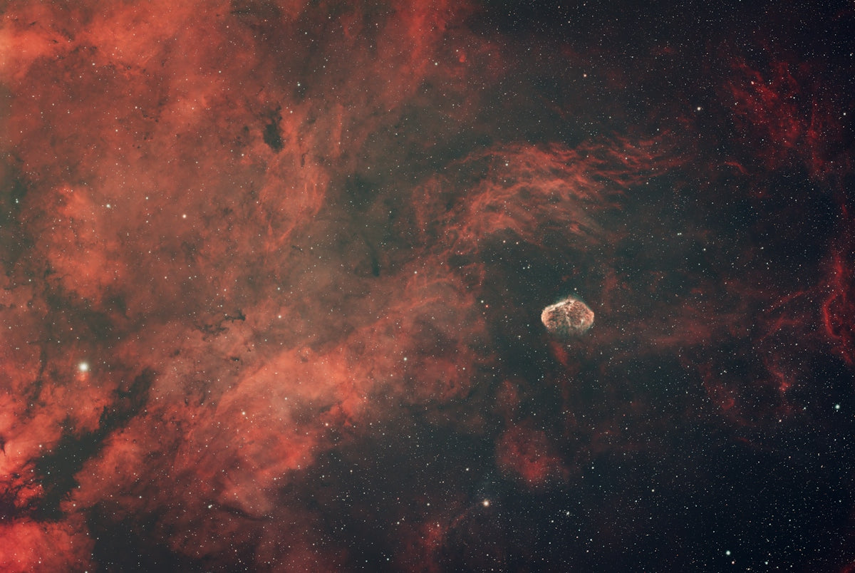 A spacecraft against a vibrant nebula