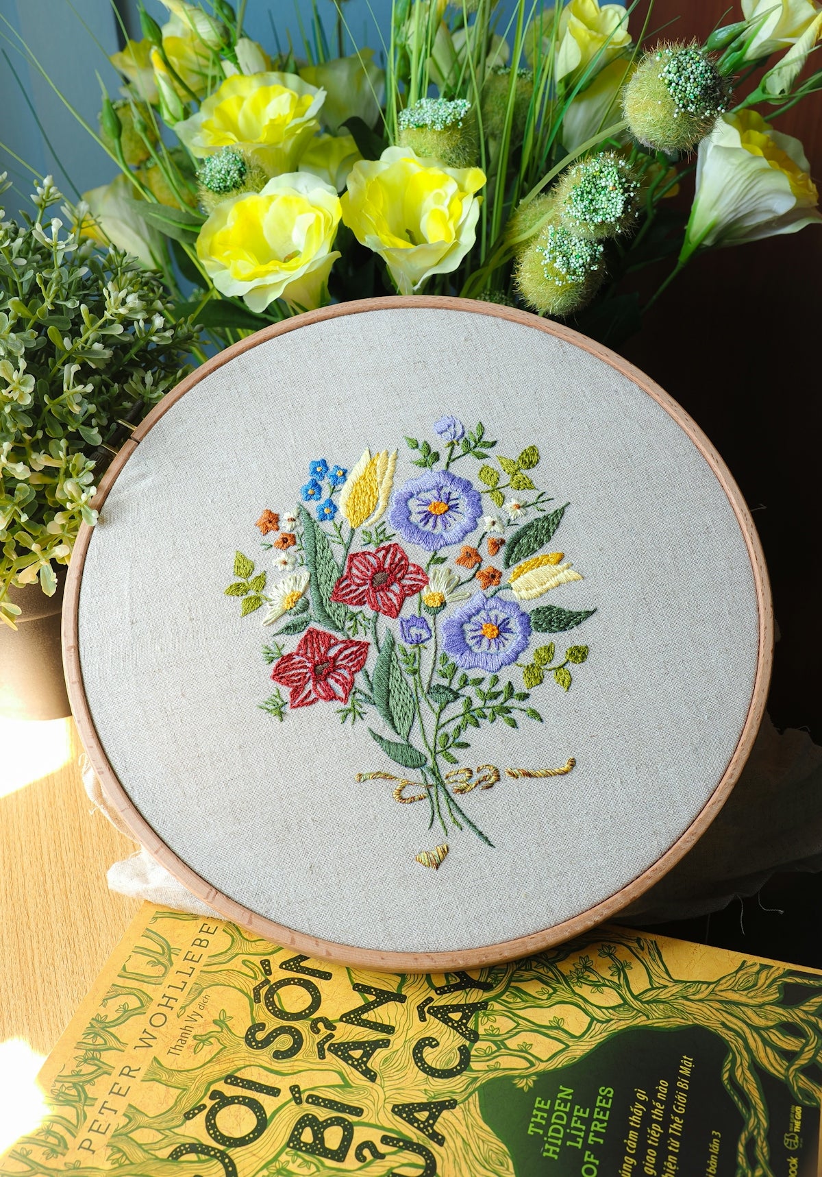 Embroidery hoop with a floral bouquet design.