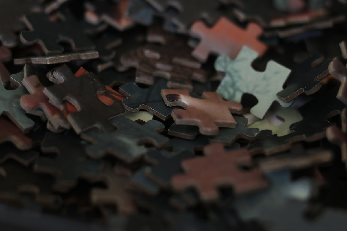 A pile of scattered puzzle pieces