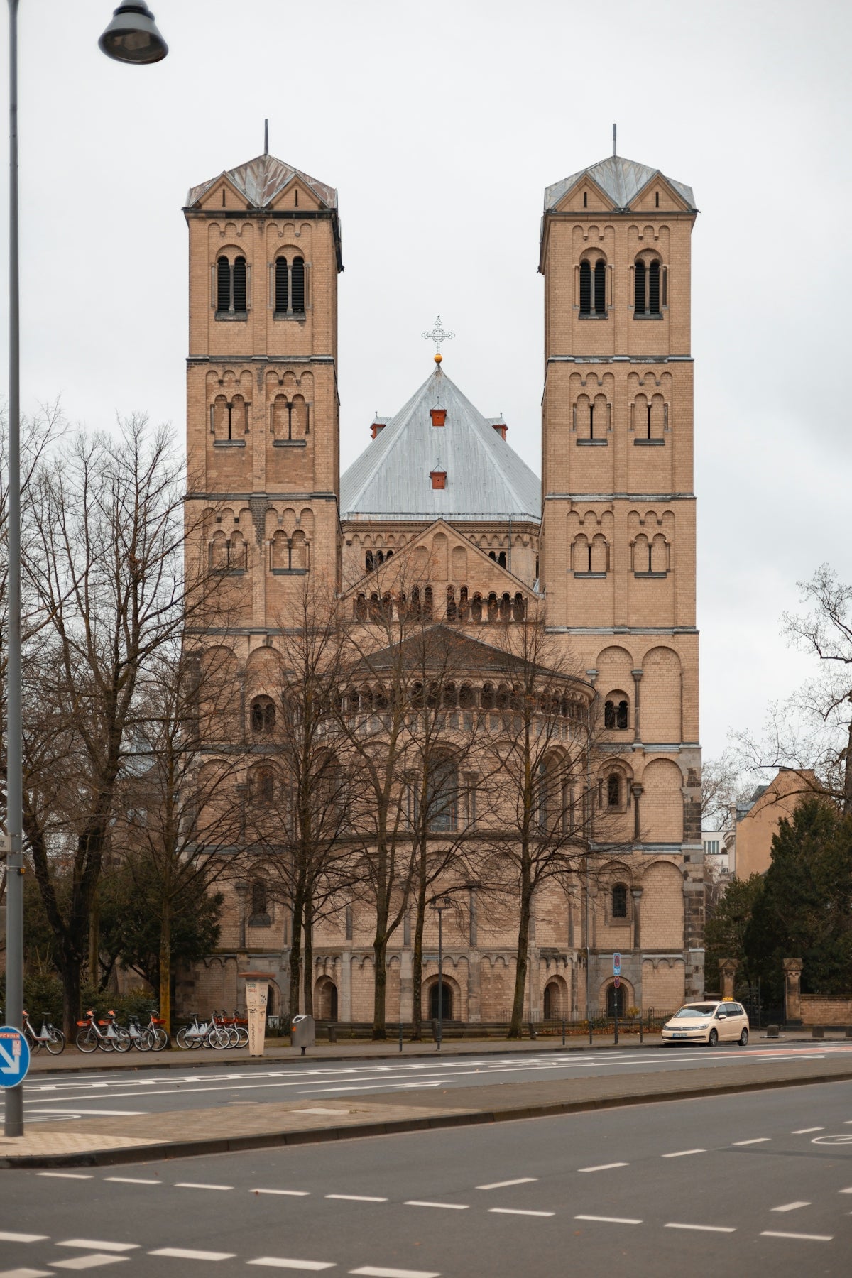 Romanesque church with two towers and bare trees
